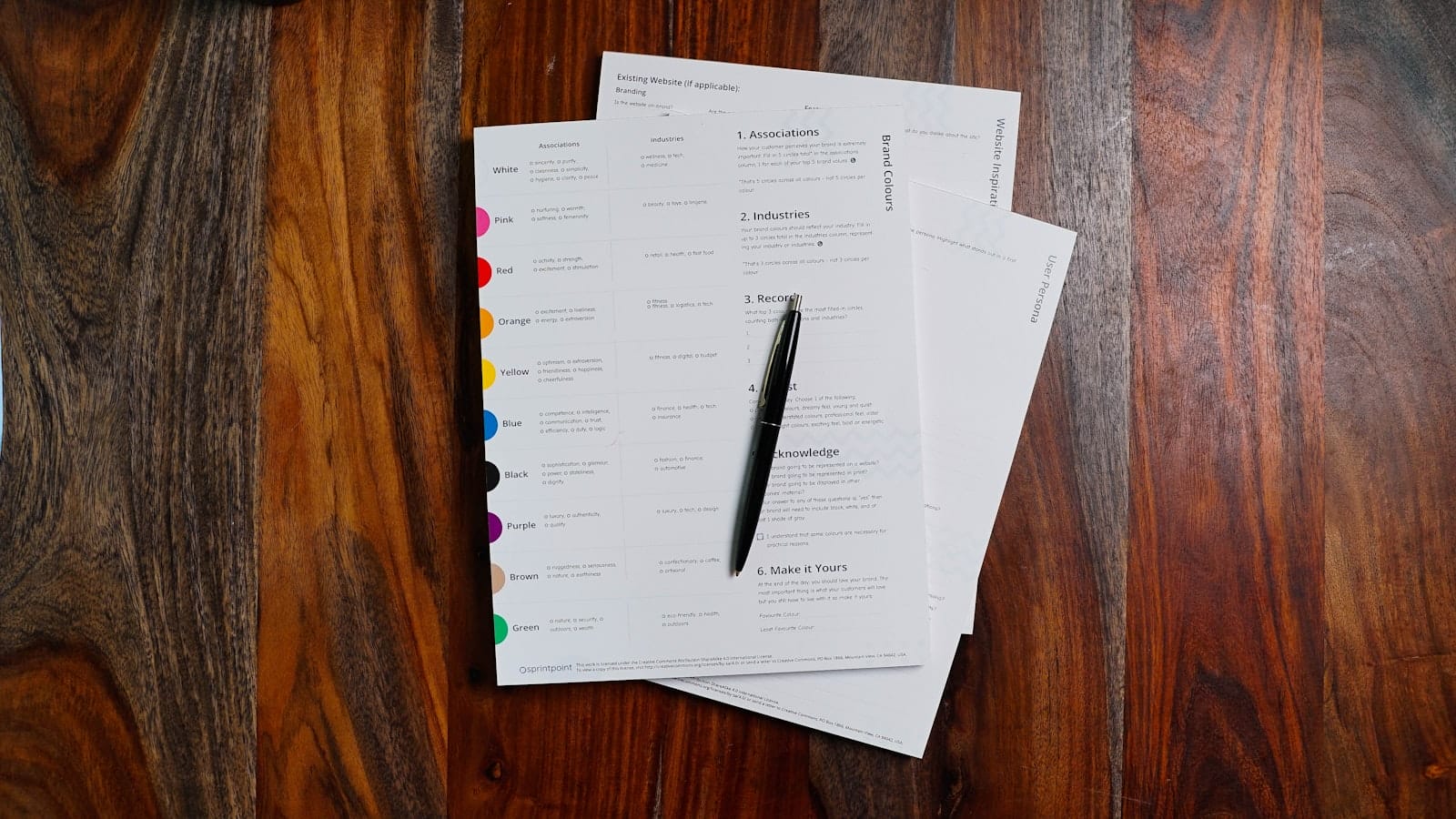 Stack of payroll papers on a desk, representing computing and documenting 13th month pay in the Philippines
