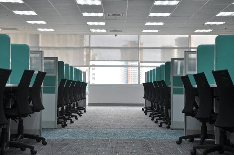 Empty, unoccupied office cubicle chairs and workstations, illustrating an employee absent without official leave (AWOL) from their post in a Philippine workplace