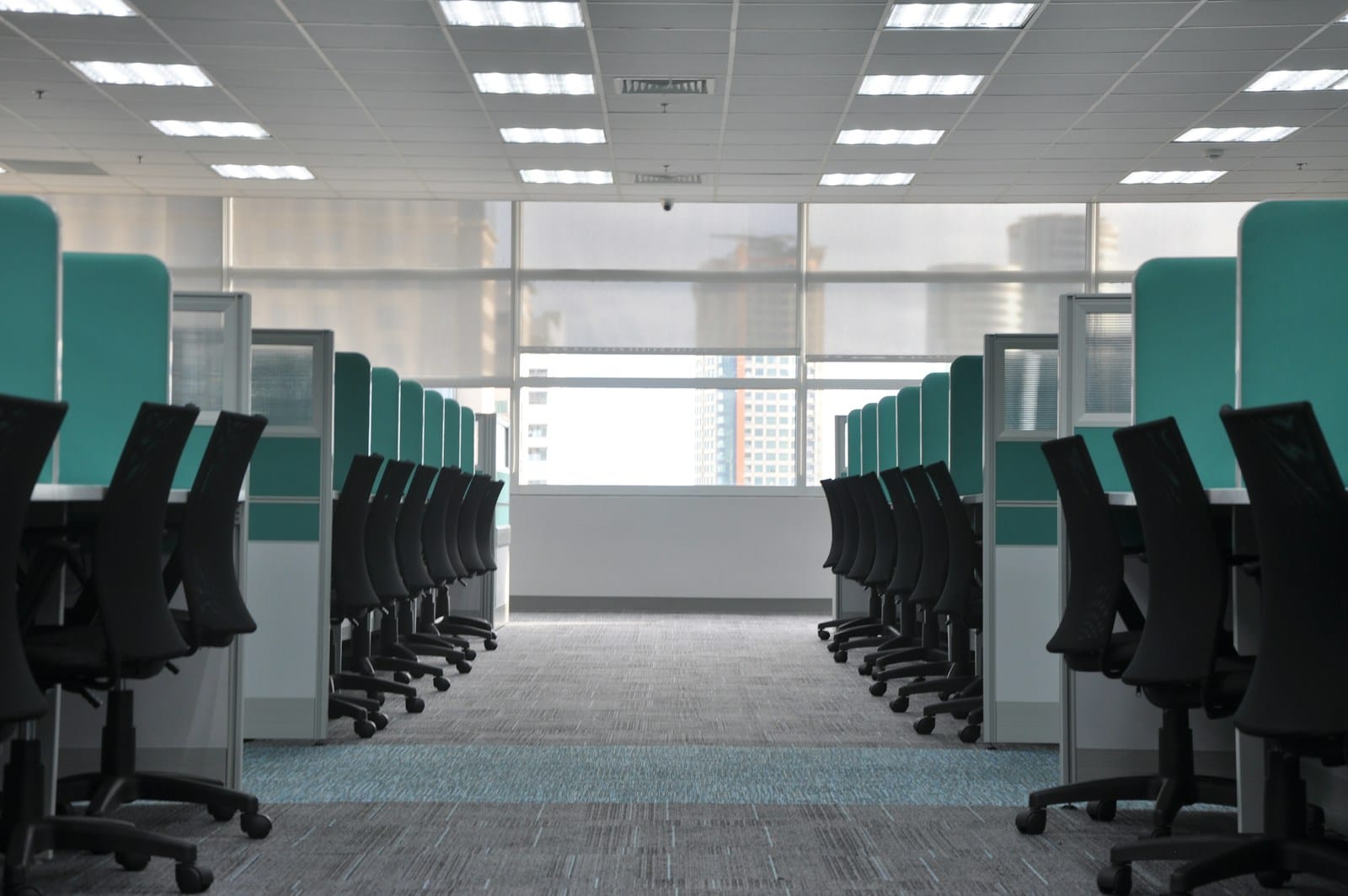 Empty, unoccupied office cubicle chairs and workstations, illustrating an employee absent without official leave (AWOL) from their post in a Philippine workplace