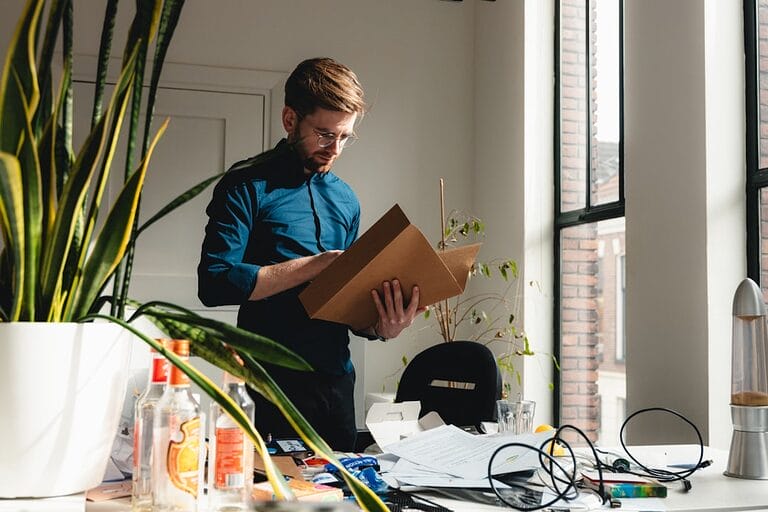Employee packing an office desk, illustrating forced resignation and constructive dismissal in the Philippines