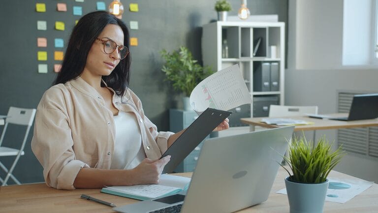 HR professional reviewing a written workplace complaint in a Philippine office, illustrating an employer's duty to investigate sexual harassment reports
