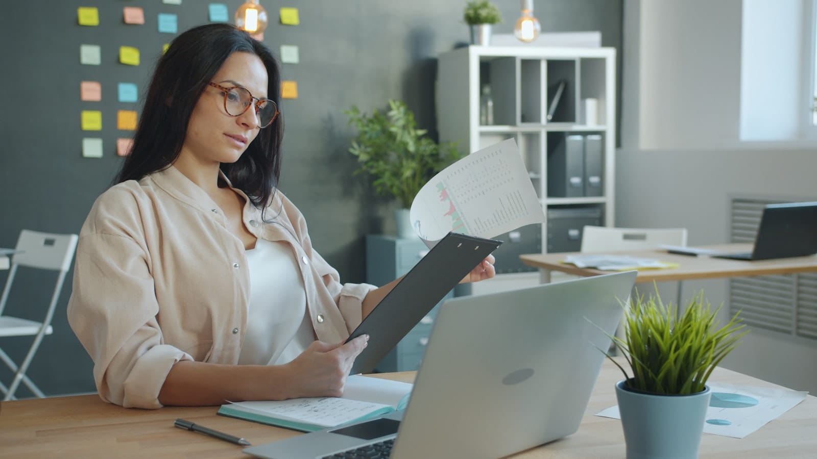 HR professional reviewing a written workplace complaint in a Philippine office, illustrating an employer's duty to investigate sexual harassment reports