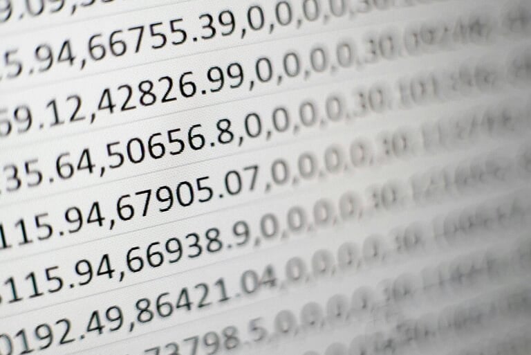 Close-up of a printed document showing itemized columns of numbers, representing the itemized earnings and deductions breakdown required on a Philippine payslip