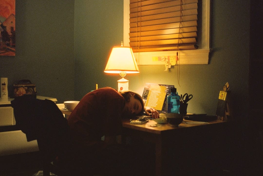 Employee working late at a desk illustrating mandatory overtime and overtime pay in the Philippines