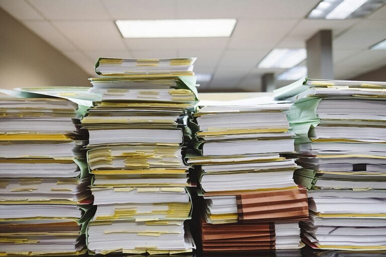 Office documents and file folders illustrating employee clearance and final pay processing in the Philippines