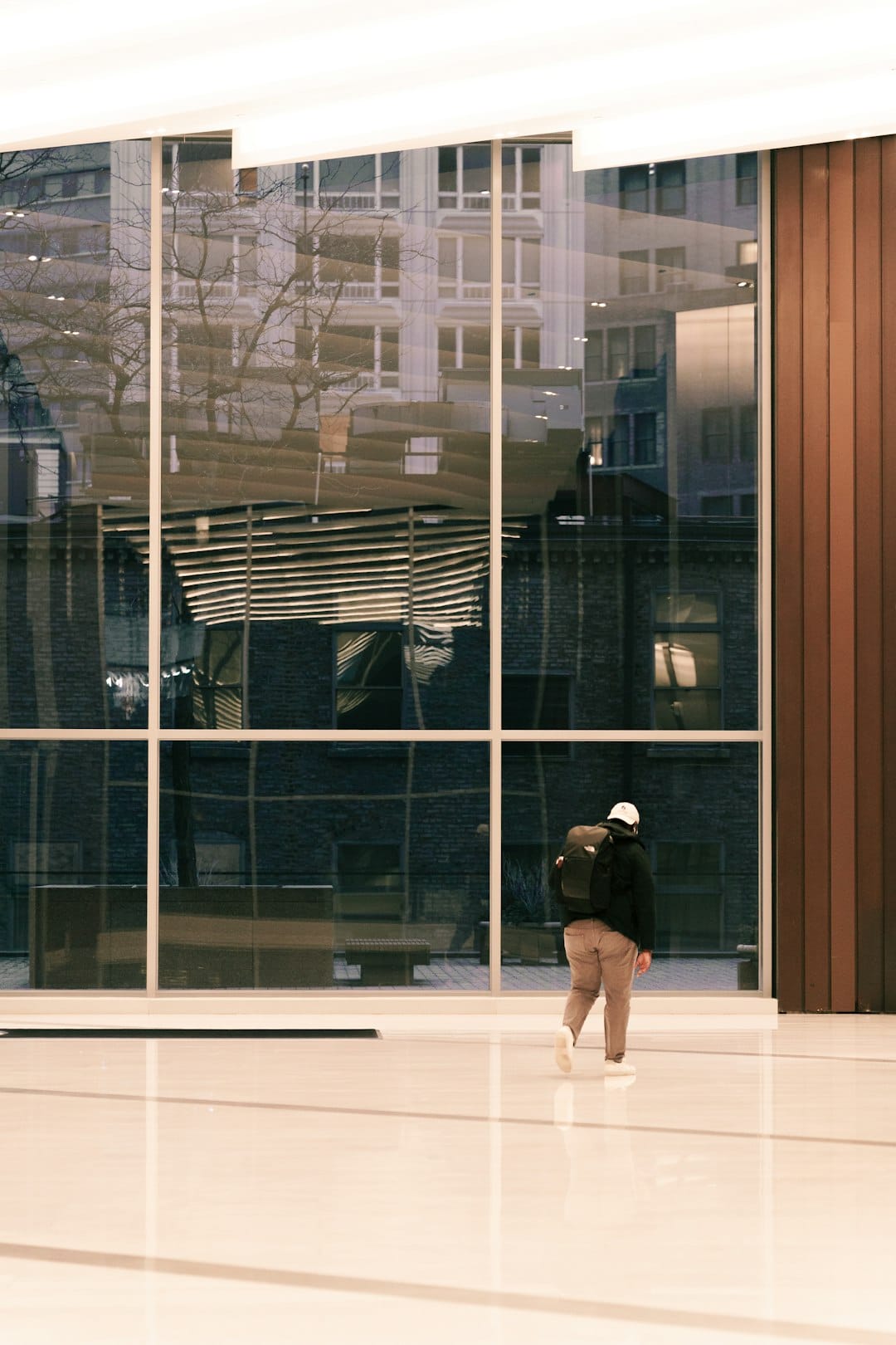 Employee walking back into the office building lobby after being ordered reinstated following an illegal dismissal ruling in the Philippines